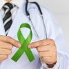 DLBCL Diagnosis and First Line Treatment: Doctor Haematologist holding a ribbon for lymphoma